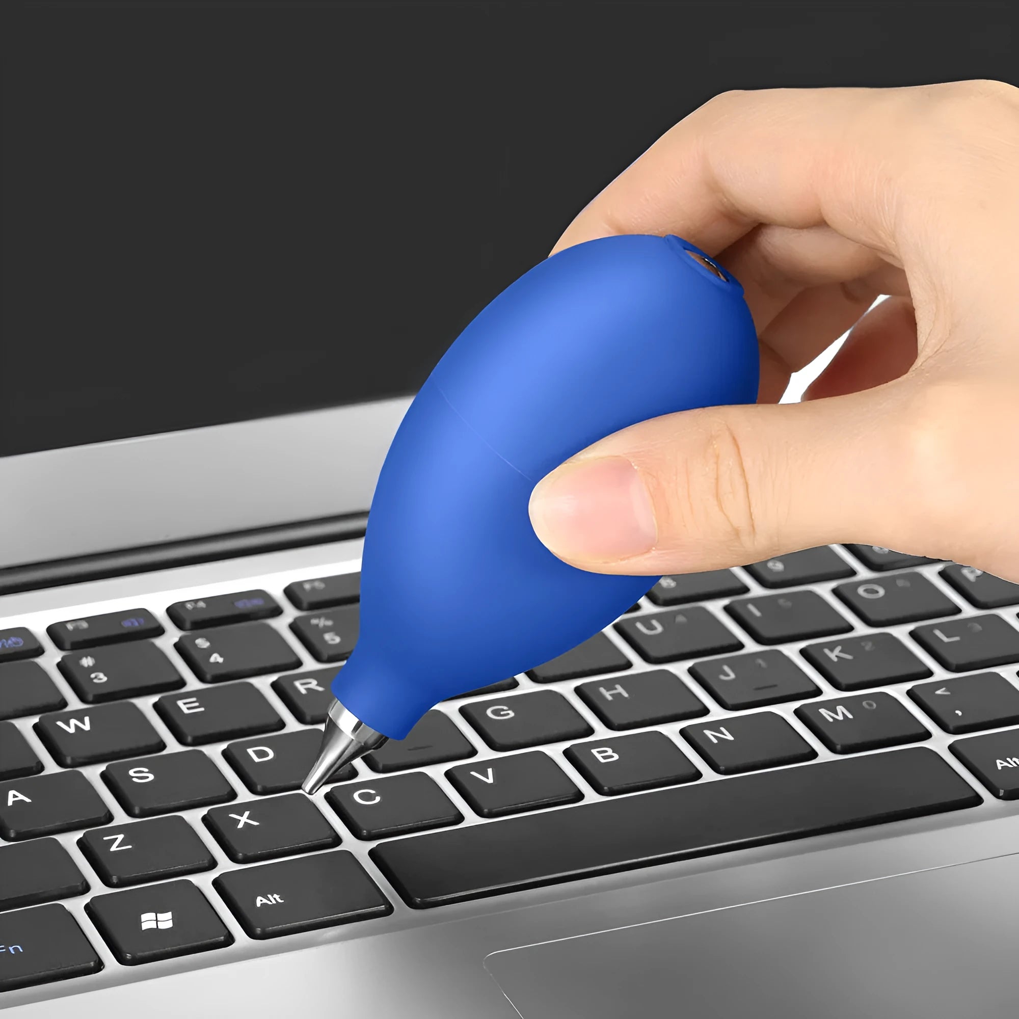 Blue and black rubber dust removal ball for cleaning cameras, phones, and clocks.