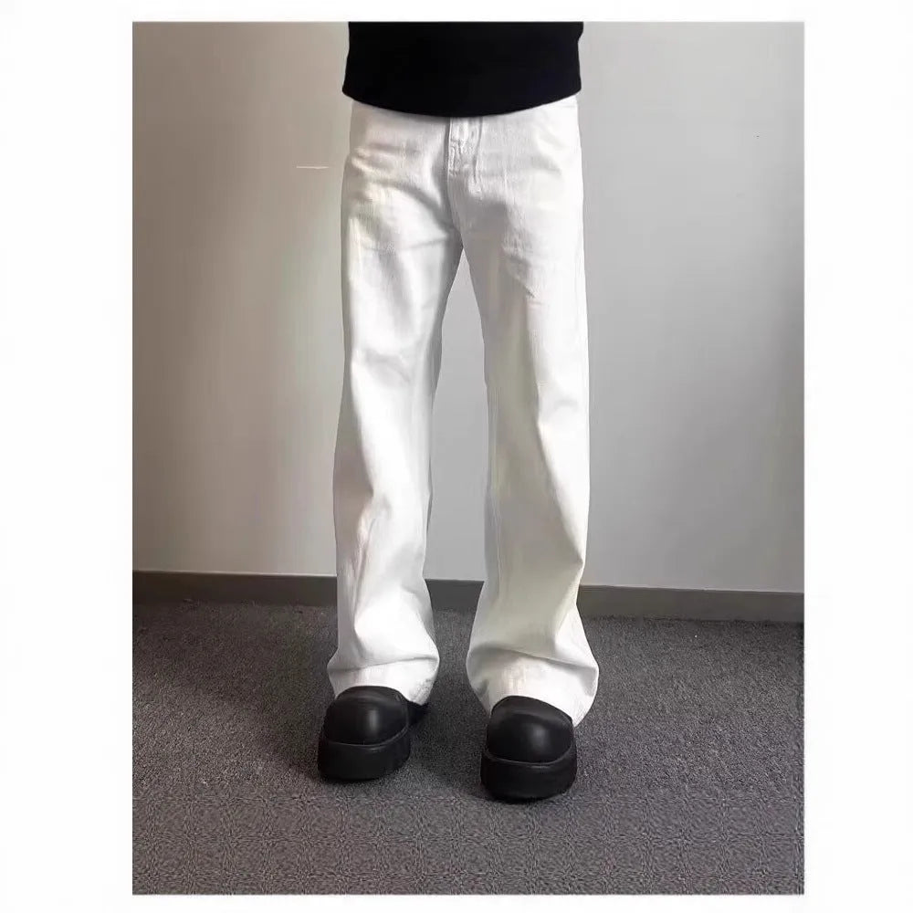 Men's white straight-leg wide fit cotton denim jeans on a neutral background.