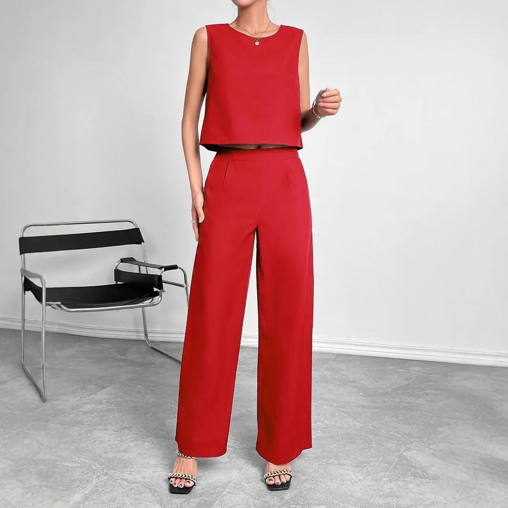 Red women's sleeveless top and wide-leg trousers two-piece set laid flat
