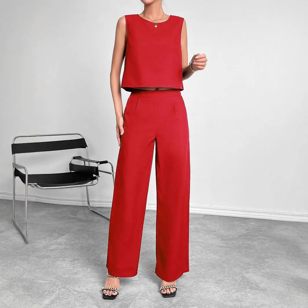Red women's sleeveless top and wide-leg trousers two-piece set laid flat