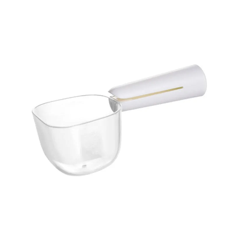 Transparent plastic pet food spoon with scale markings for measuring cat and dog dry food, available in Blue Pink White