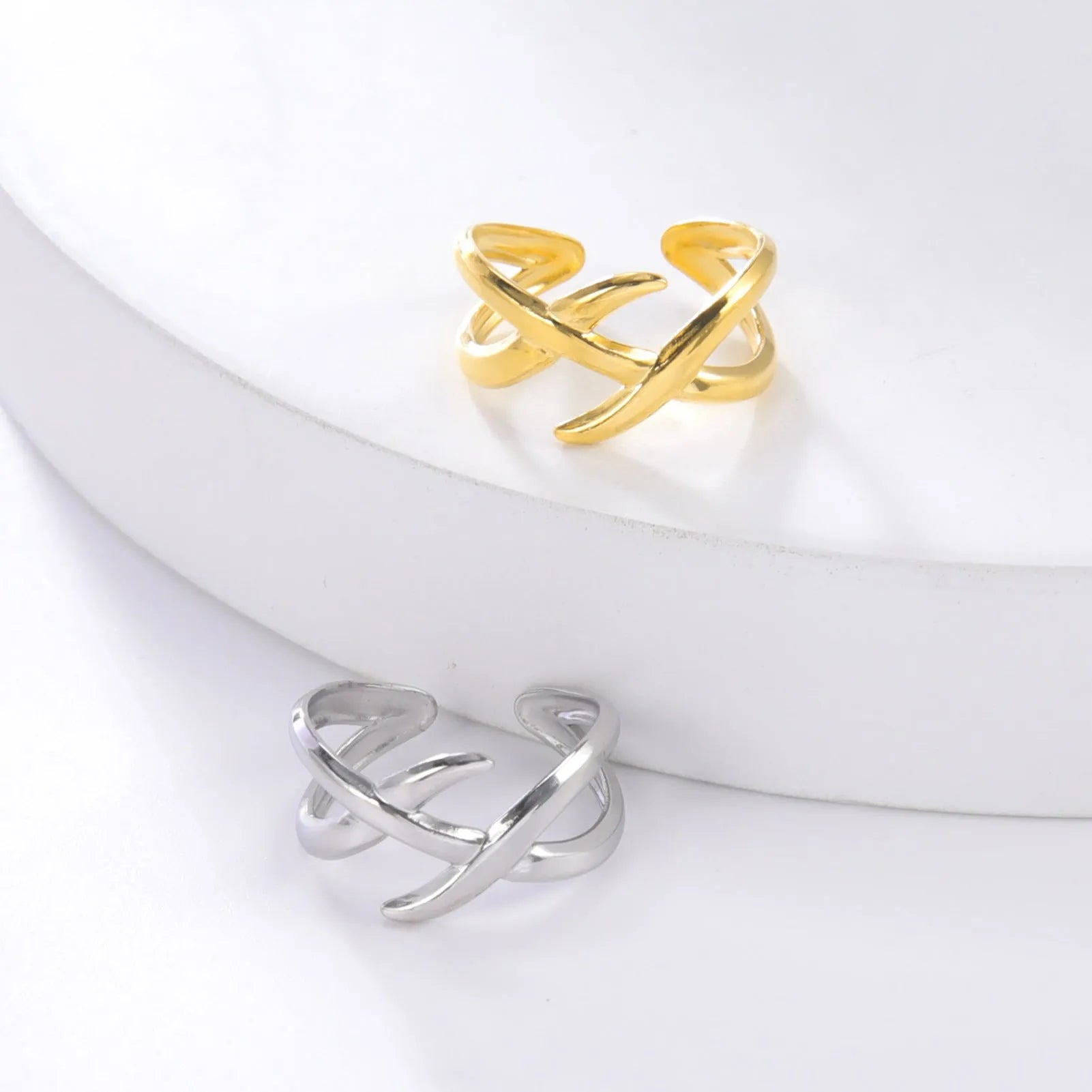 Retro women's stainless steel open ring in gold colour with adjustable opening on white background