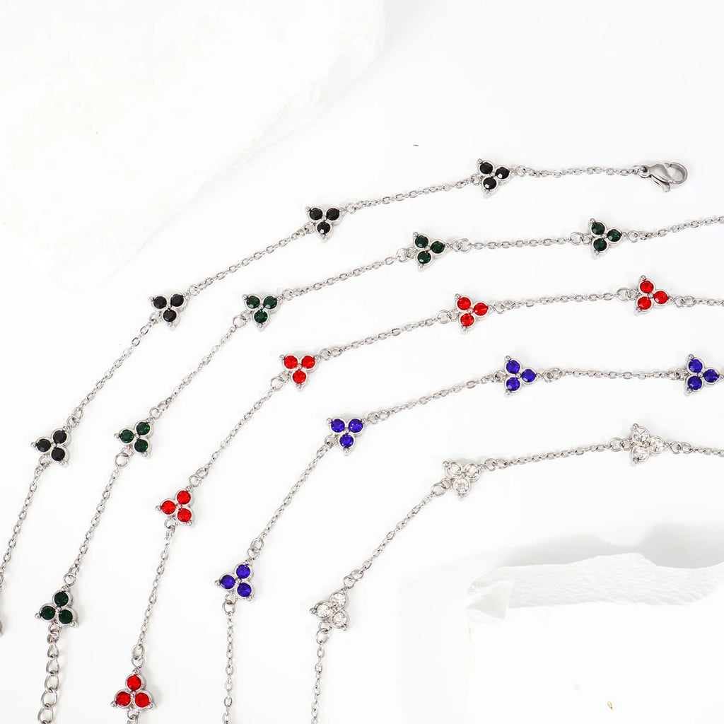 Stainless steel women's bracelet with three triangular zircon stones in a choice of colours and metal finishes.