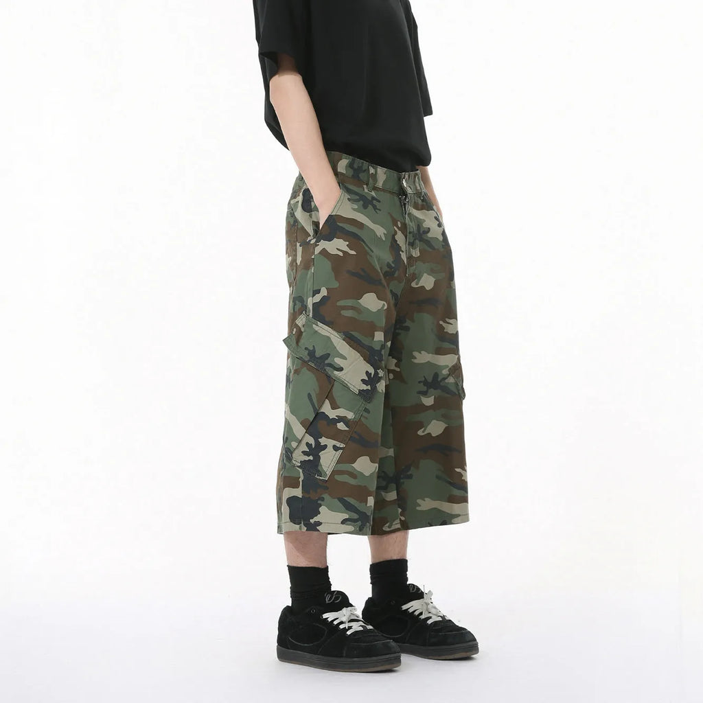 Men's cotton camouflage cargo trousers showing wide leg fit, large pockets, and side stitching details
