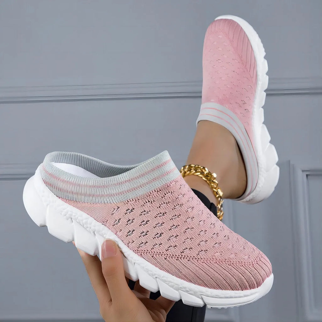 Women's striped Flyknit sports slipper in black with hollowed-out design and height-increasing sole.