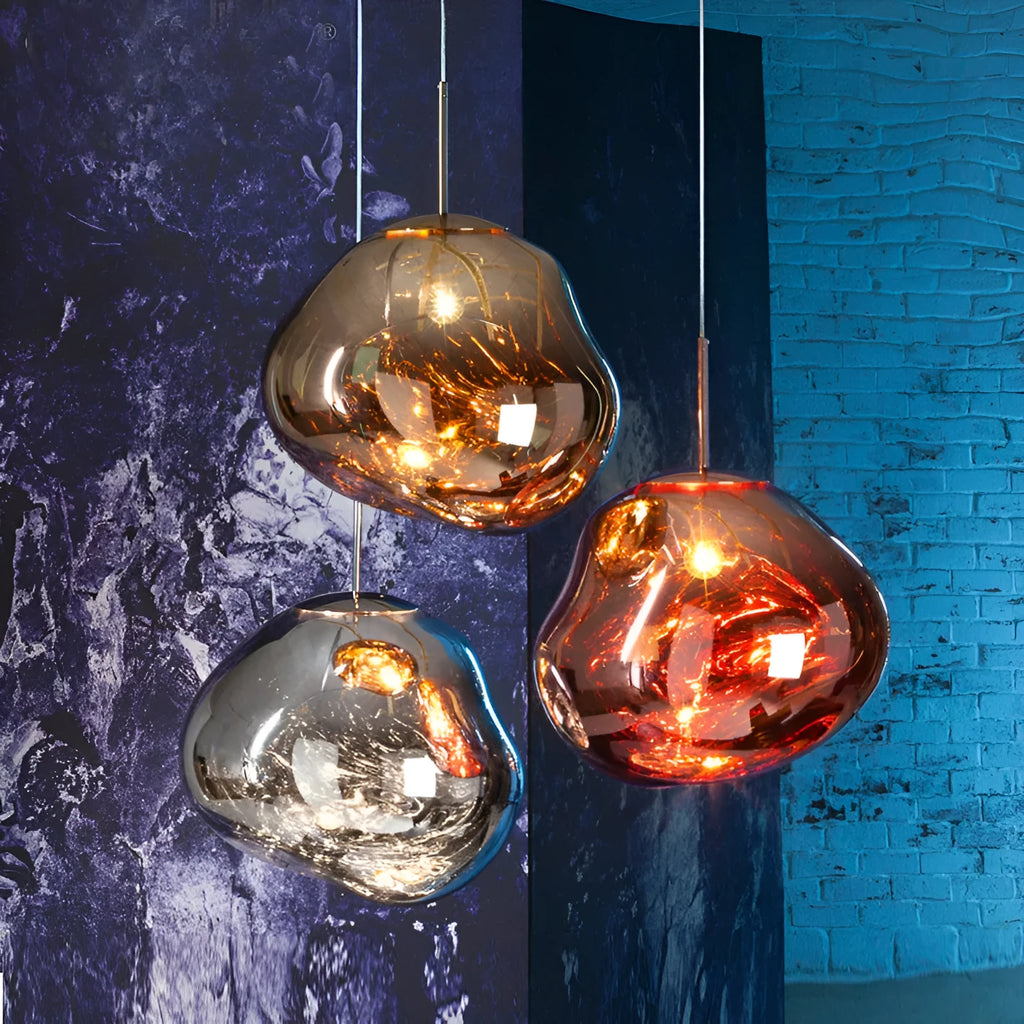 Nordic post-modern lava lamp chandelier with glass body and metallic finish in bedroom setting