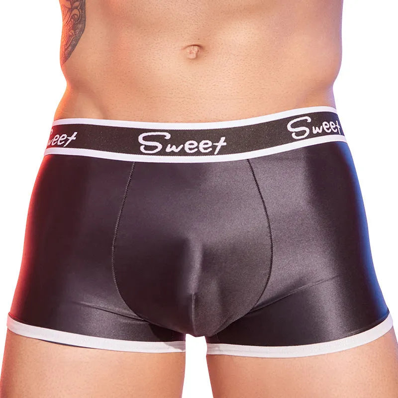 Men's silky nylon boxer shorts in black, white, and sapphire blue colours.