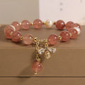 Pink strawberry quartz and white freshwater pearl bracelet with bee charm and zircon accents