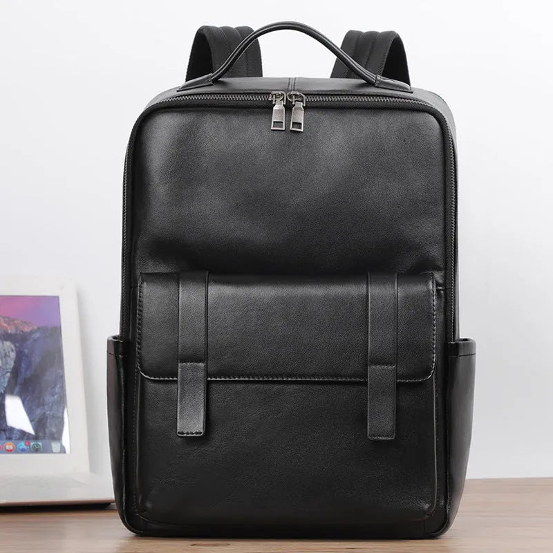 Men's black genuine leather computer backpack with woven detailing and physiological curve back plate