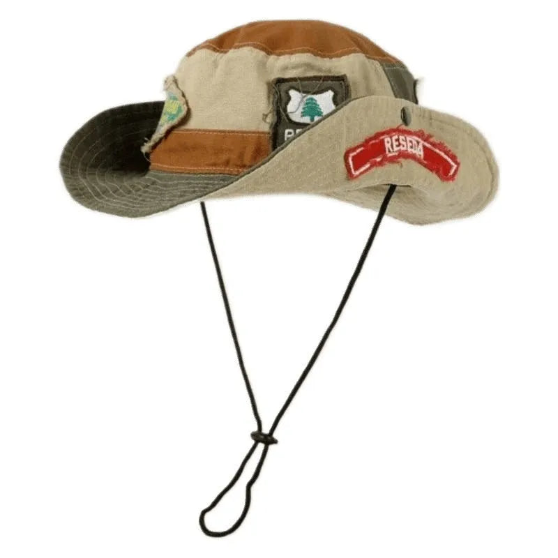 Army green cotton women's fisherman hat with hand-painted patchwork details and a flat top crown.