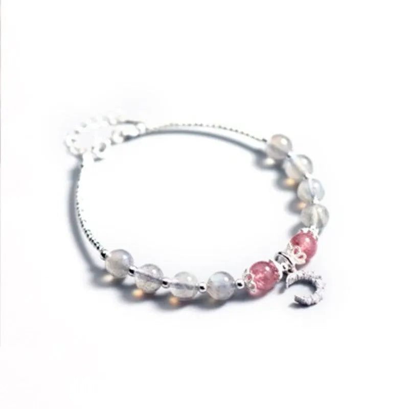 Natural moonstone adjustable bracelet with crescent moon charm and crystal accent on wrist