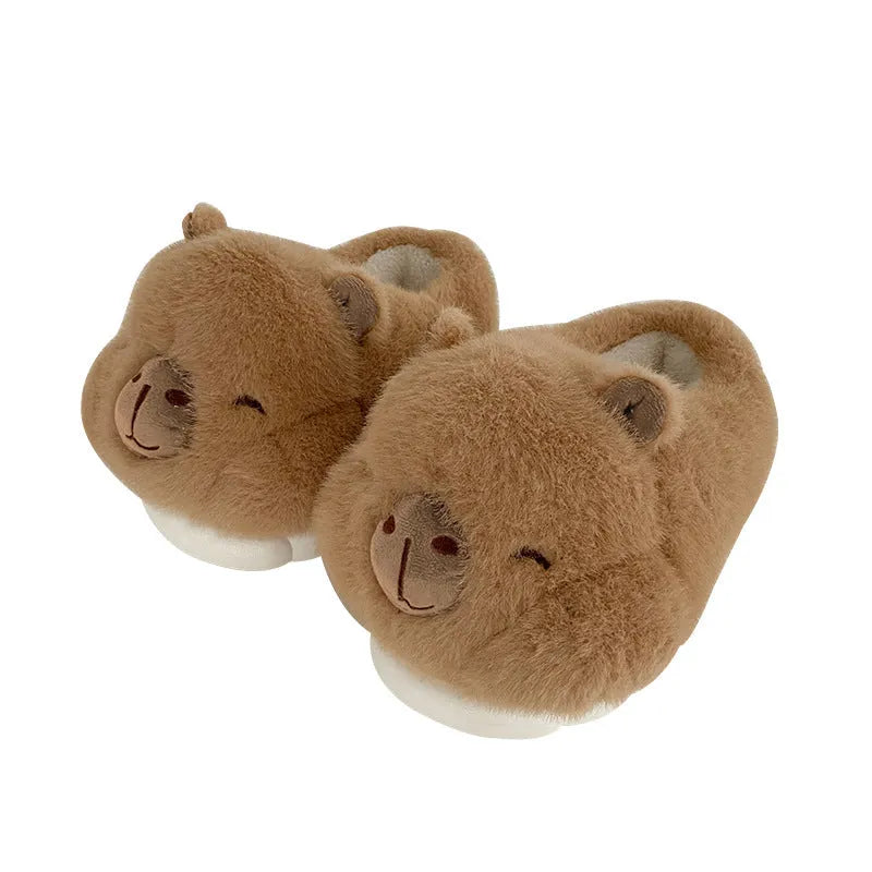 Light brown women's winter slippers with a cartoon pattern, plush upper, and wool lining.