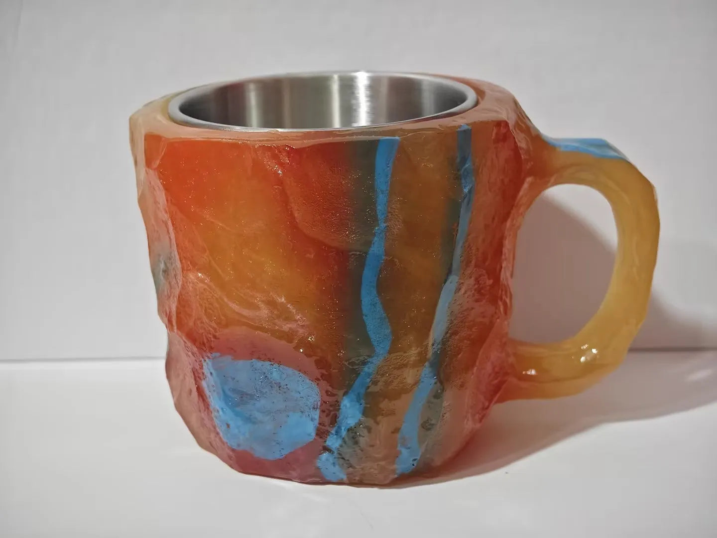 400ml resin coffee mug with handle in a choice of colours including blue, purple, and rock pattern.