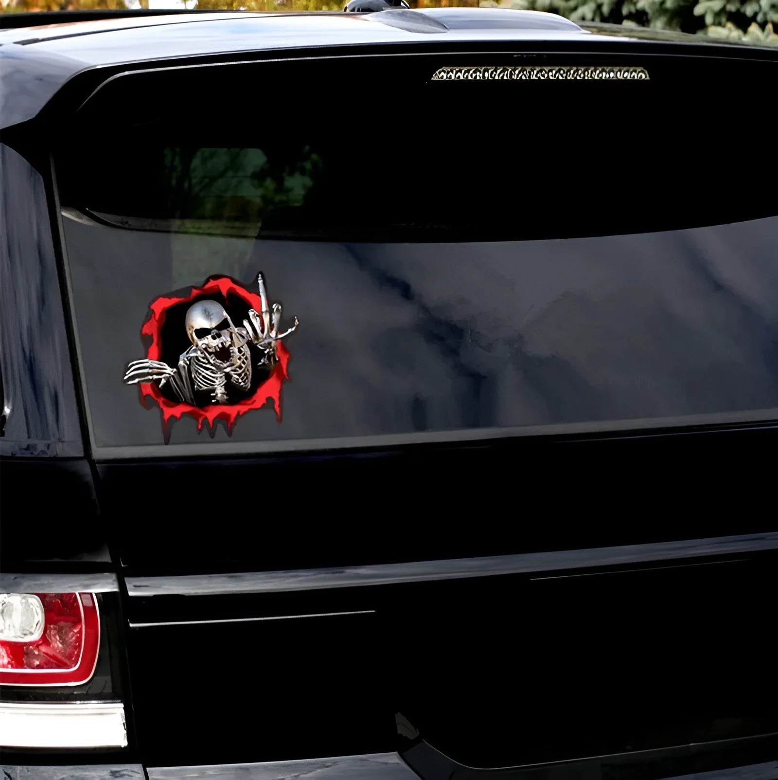 Colourful reflective metal skull bumper sticker on white background, measuring 15cm by 14cm.