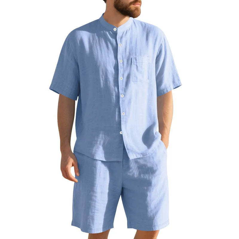 Men's light blue linen two-piece suit with Henry collar, short sleeves, and matching shorts for summer wear