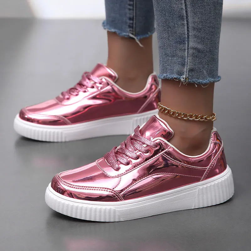 Sequin platform sneakers with thick sole in rose gold colour showing round toe and decorative stitching