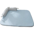 Blue big-eyed monster design breathable pet cooling bed for dogs and cats on a wooden floor.