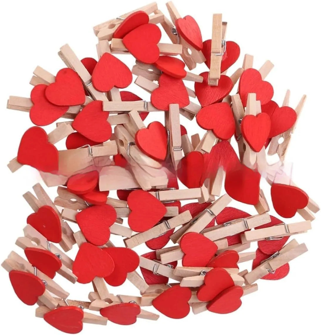 Five handmade solid wood heart-shaped clips in red, pink, white, yellow colours on a wood surface.