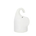 Soft silicone elephant night light with warm white LED glow on bedside table