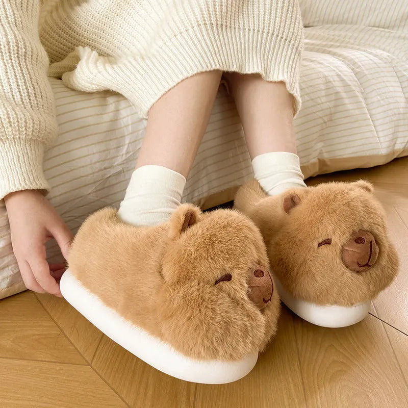 Light brown women's winter slippers with a cartoon pattern, plush upper, and wool lining.