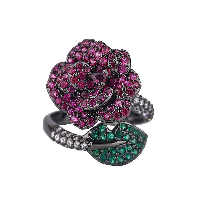Geometric black gold women's ring with simulated red corundum stone and flower design elements