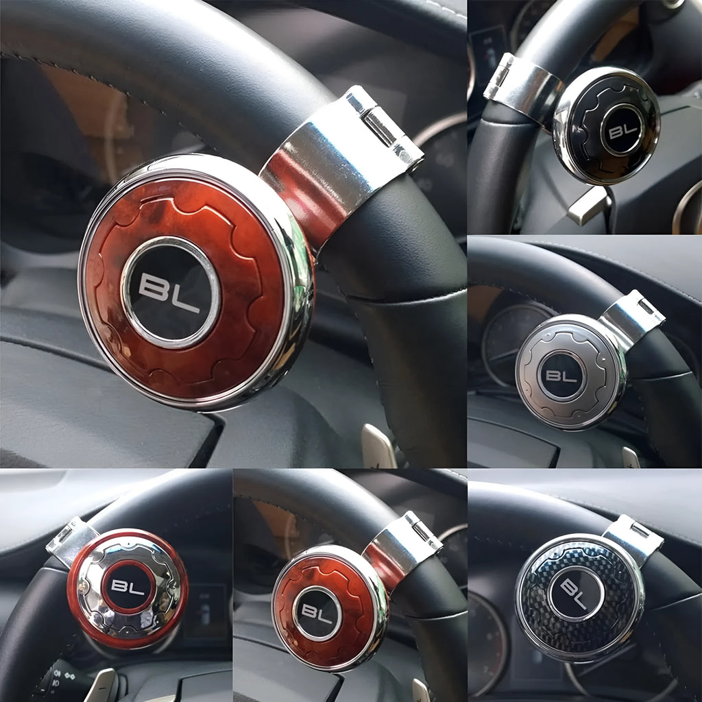 Metal universal steering wheel assist ball with steel ball bearing in silver finish mounted on a car steering wheel for one-handed control