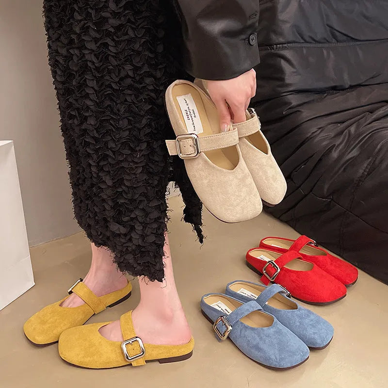 Women's flat closed toe slippers with square head in apricot, blue, red, or yellow colours on a rubber sole.