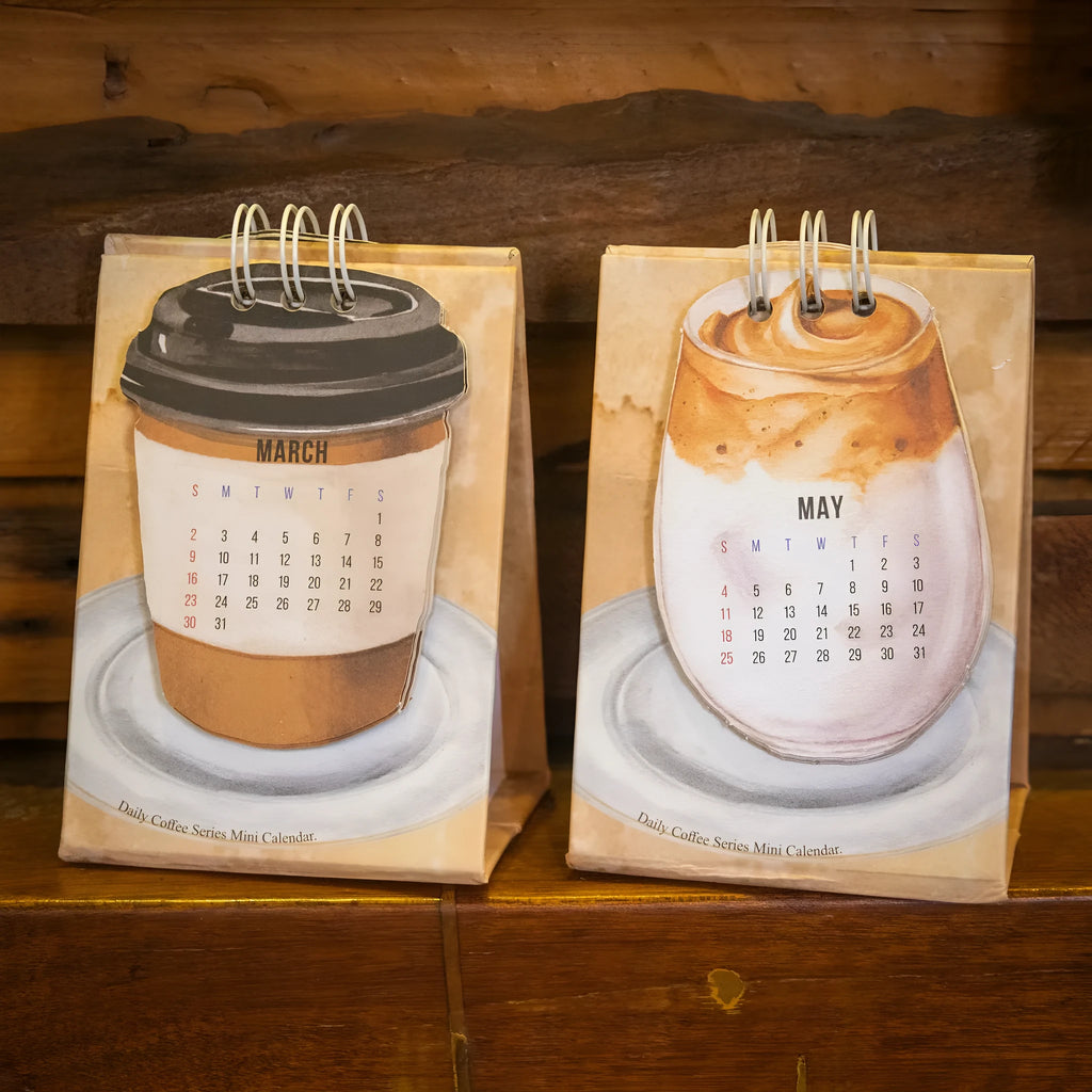 A5 size 2025 mini desk calendar open to a page showing a date and motivational quote.