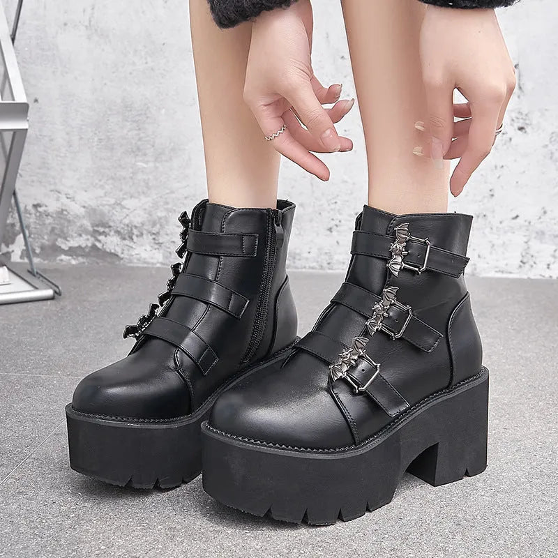 Black women's punk ankle boots with bat buckle decoration and side zip closure
