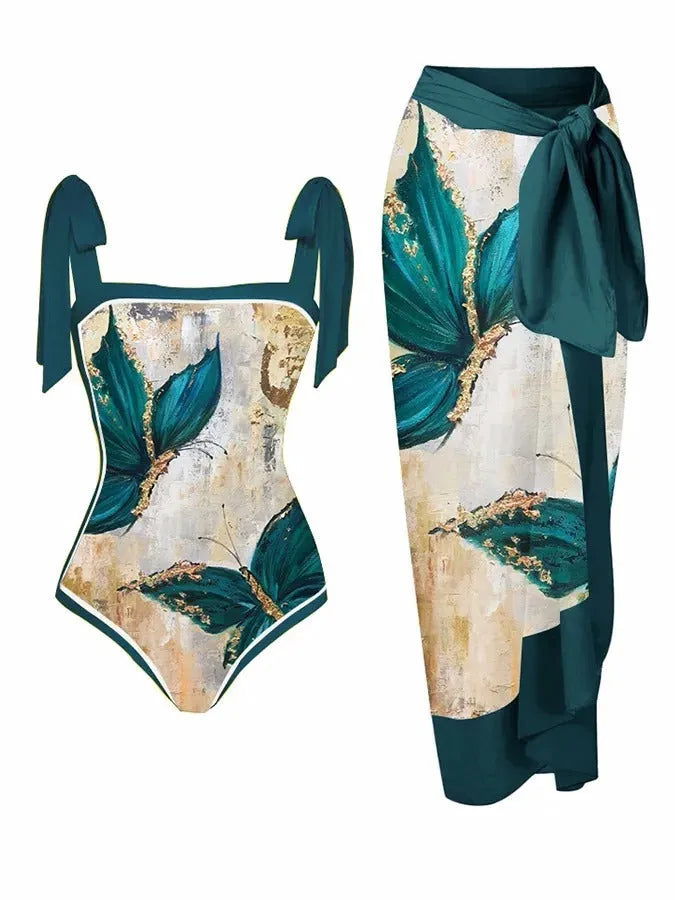 Women's printed two-piece swimsuit with a flowy chiffon skirt in a floral pattern design.