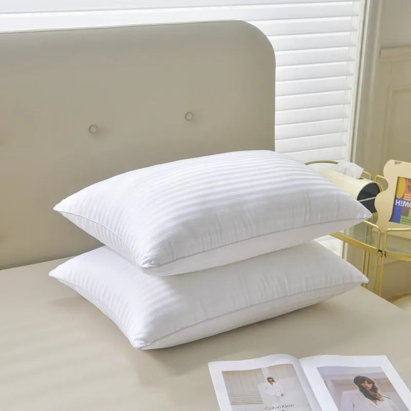 White feather pillow with cotton satin stripe pillowcase showing three size options
