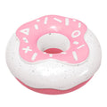 Pink donut-shaped dog chew toy with textured surface for dental cleaning on white background