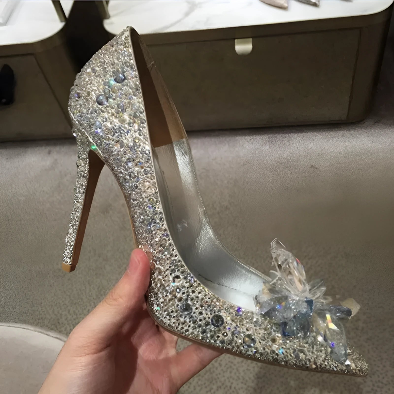 Women's gold stiletto high heels with rhinestone decoration on pointed toe