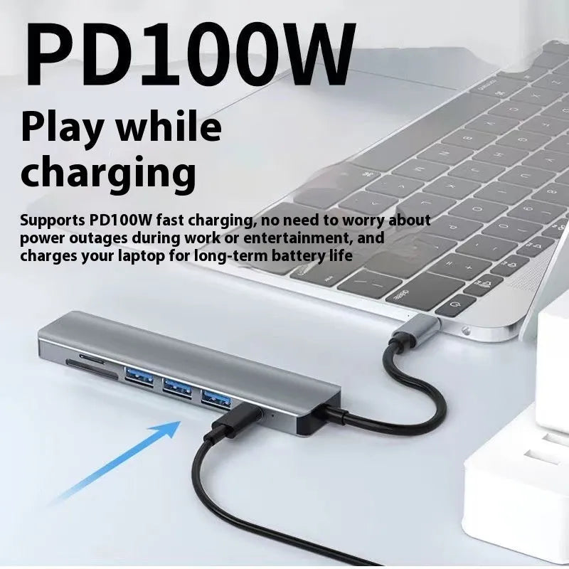 USB-C 7-in-1 aluminium expansion dock with HDMI port, USB ports, and card slots.
