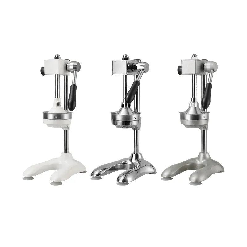 Stainless steel manual vertical juicer with zinc alloy parts and selectable head styles on a kitchen counter.