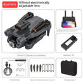 Black foldable quadcopter drone with four propellers and a mounted camera, shown next to its remote control.