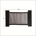 Elasticated grey polyester storage net stretched across a car boot, holding assorted items.