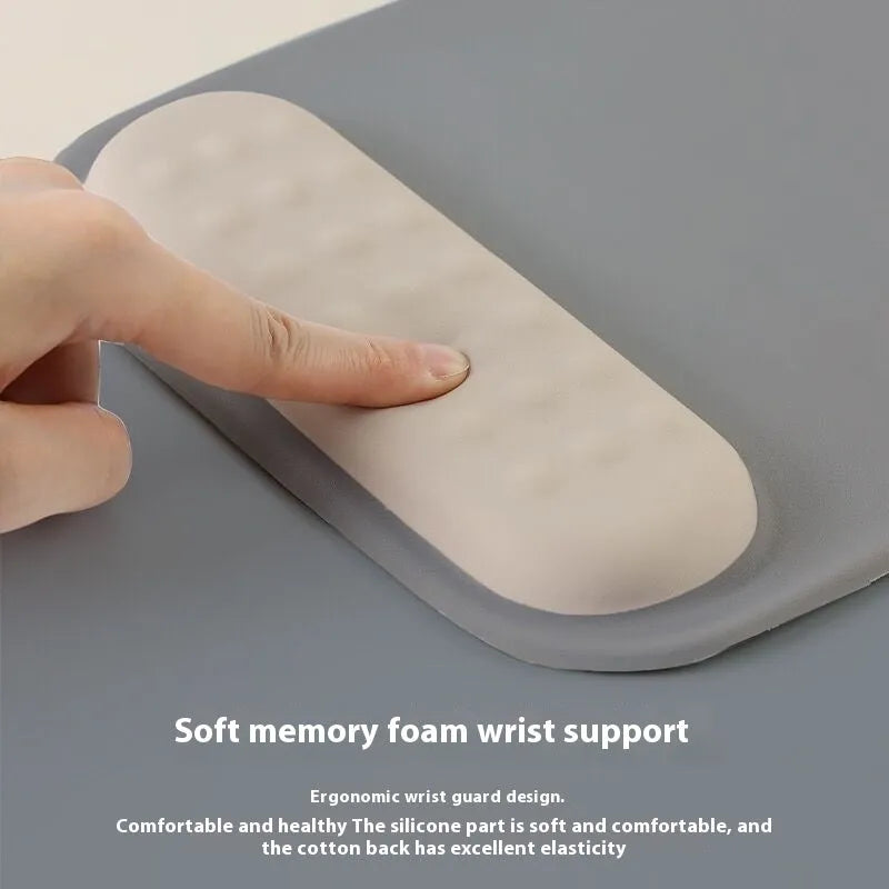 Ergonomic cloth silicone mouse pad with built-in wrist rest in a choice of colours.