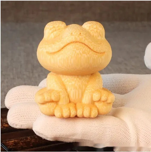 Solid bamboo smiling frog carving ornament measuring 5cm height with cartoon design