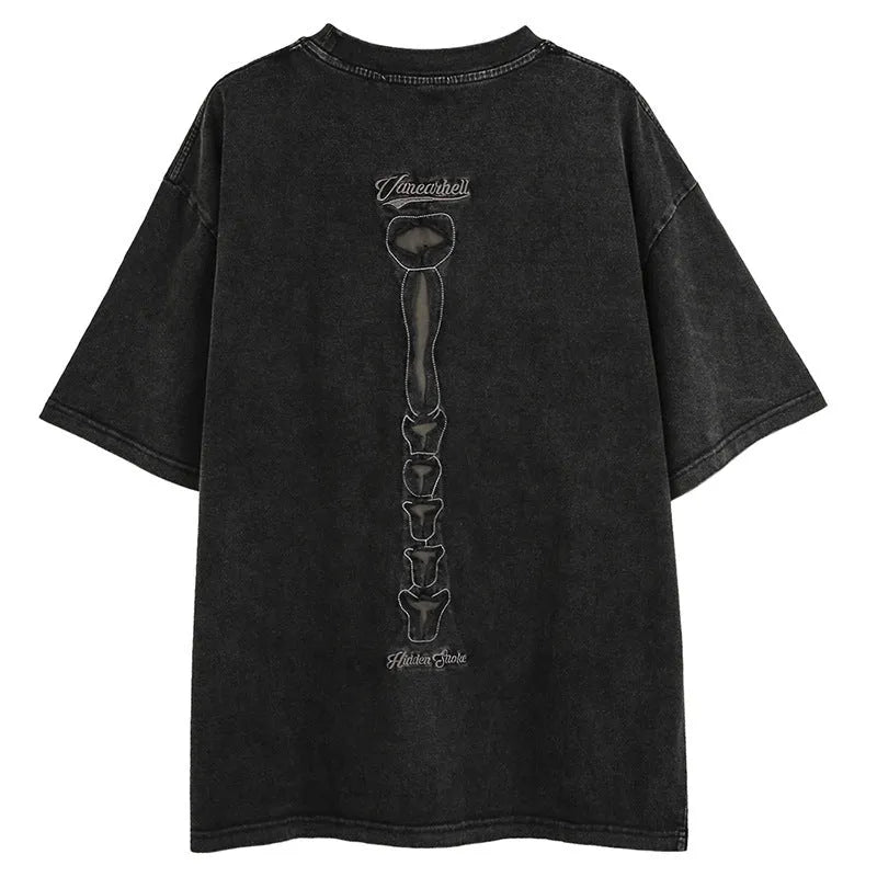 Men's black cotton t-shirt with skull and letter print, showing loose fit and drop-shoulder sleeves.