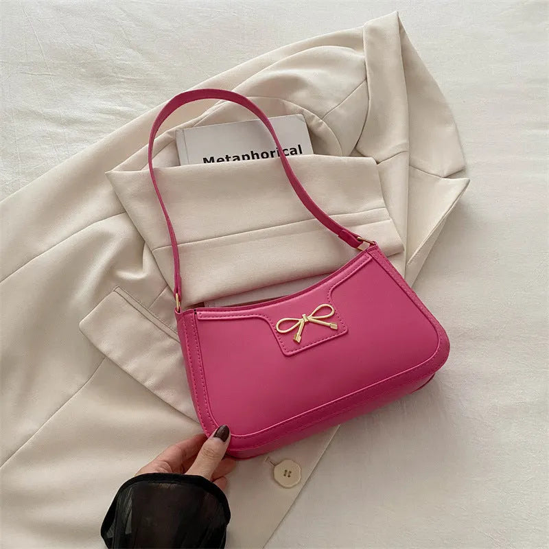 Portable shoulder western style bagg bag in PU with bow accent, available in six colours, 24x14x5 cm