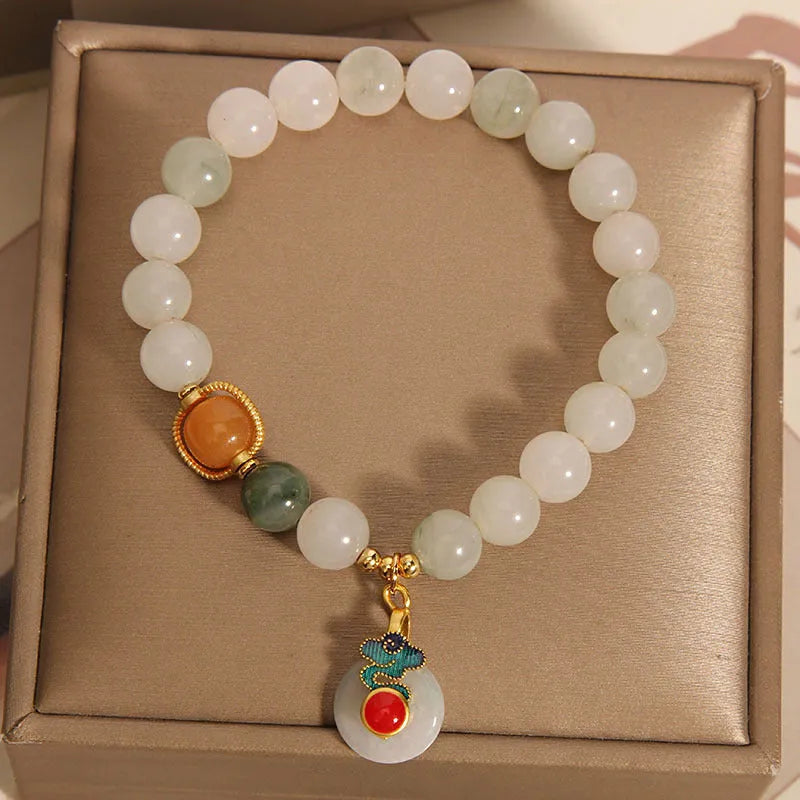 Women's ice jade crystal bracelet with pearl accents and retro design on display