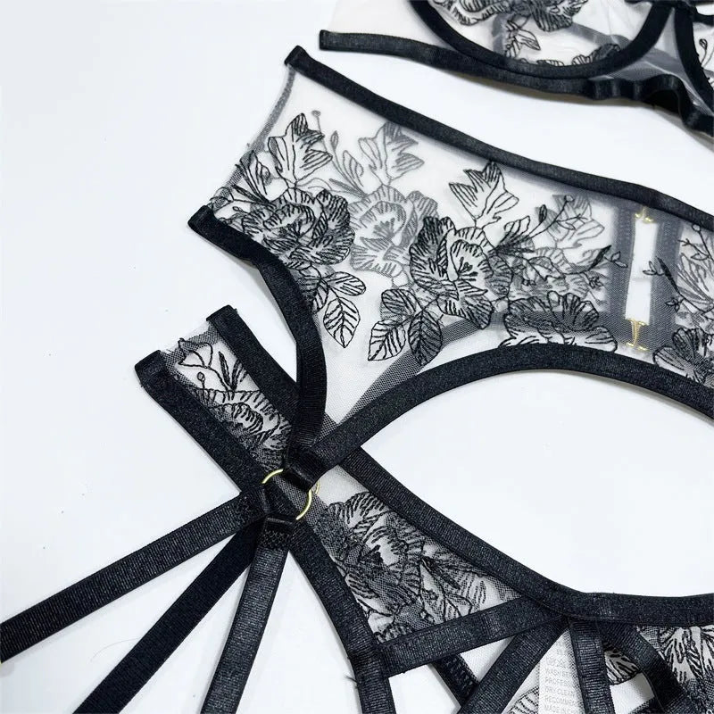 Women's black lace three-piece set with floral print showing top, pants and waist ring on hanger