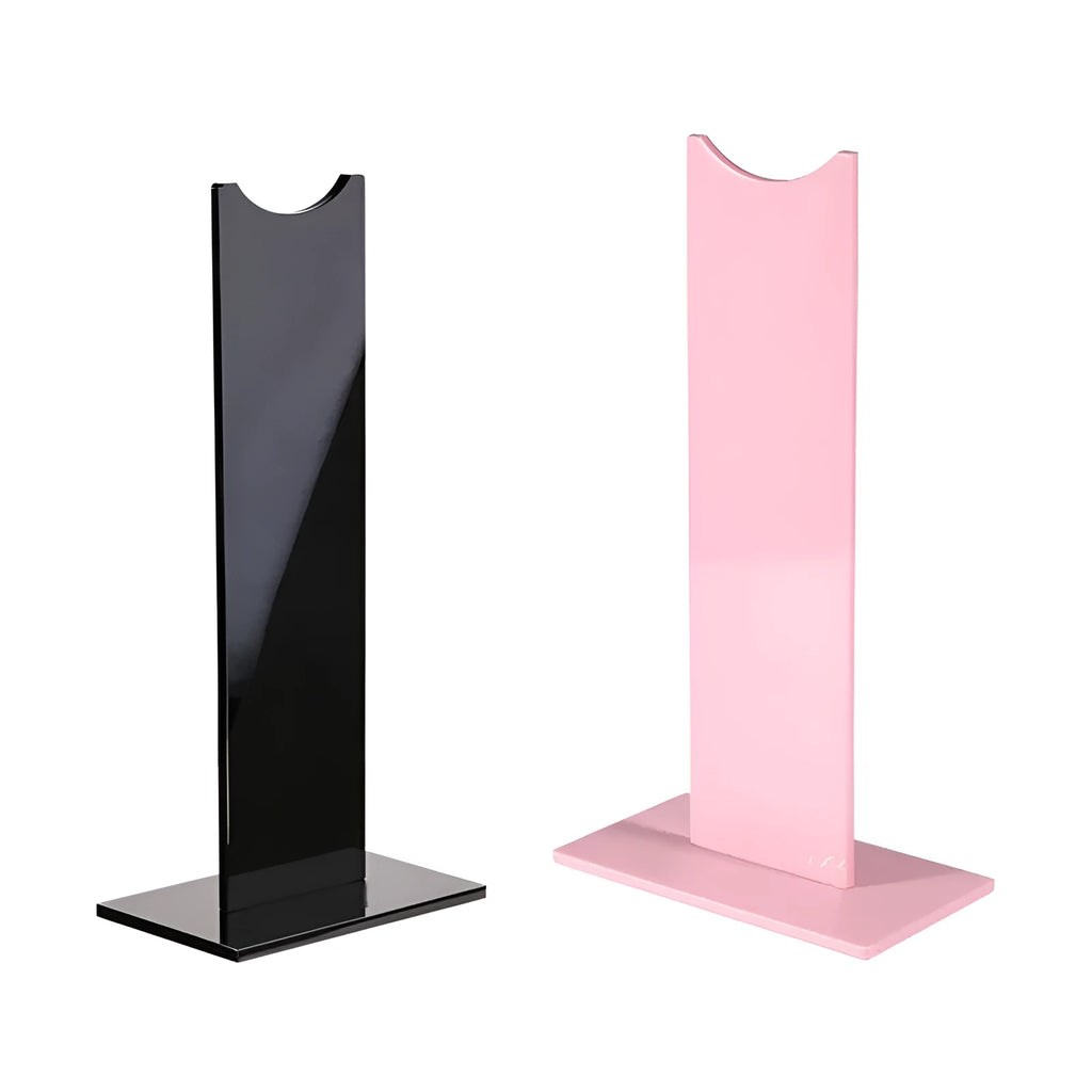 Pink detachable headphone stand with non-slip silicone base displaying over-ear headphones