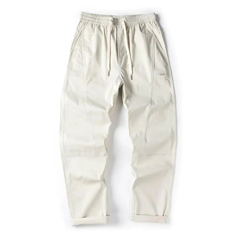 Milky white wide-leg antibacterial cotton trousers shown flat lay