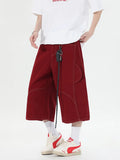 Retro denim workwear shorts with multiple pockets and wide leg design in black colour