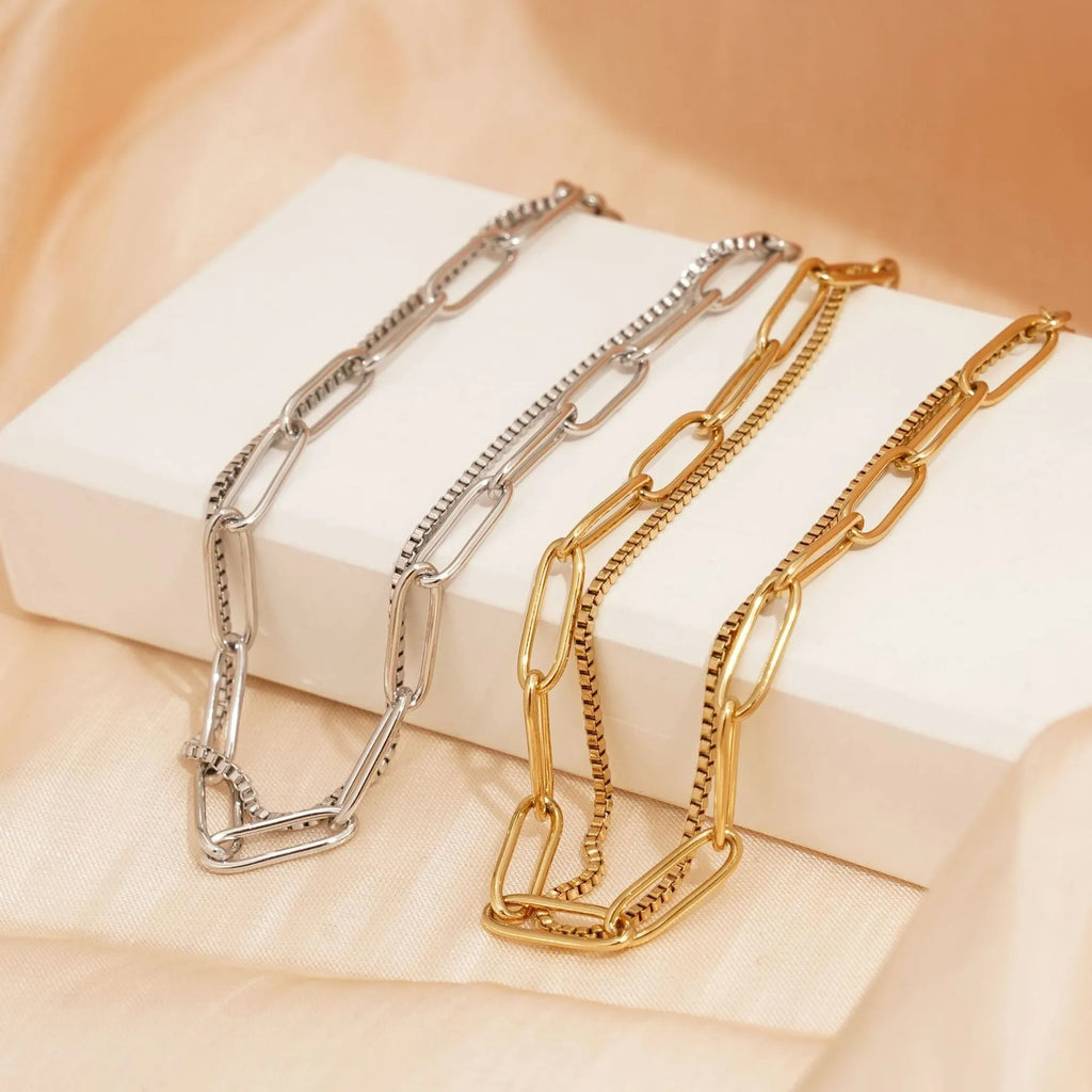 Double layer geometric stainless steel bracelet with linear elements in gold or silver electroplated finish