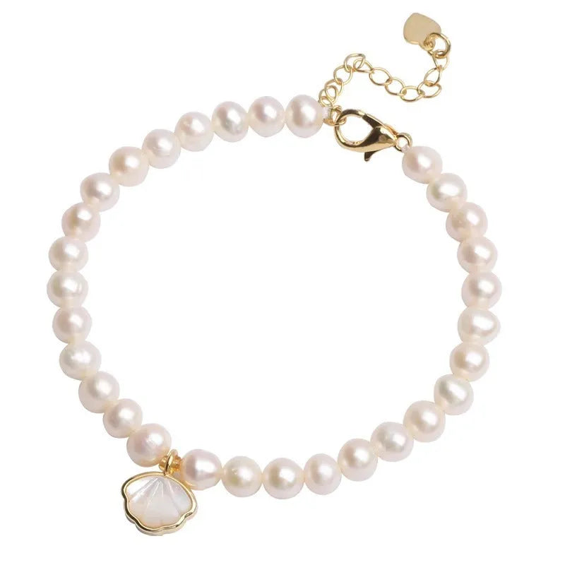 Women's freshwater pearl bracelet with fan-shaped shell design on 16cm elastic or extension chain
