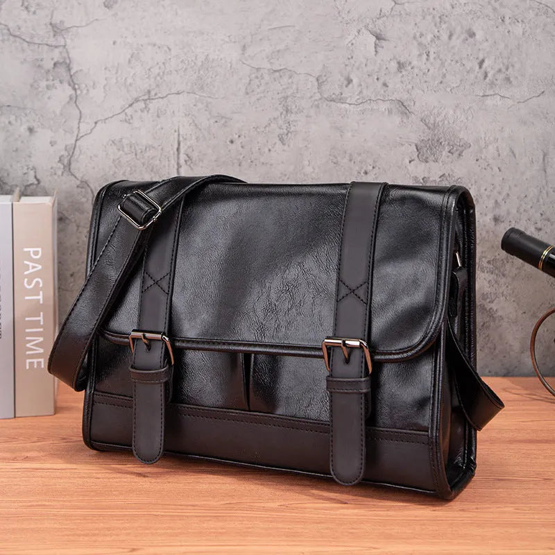 Black Korean-style men's anti-theft commuter backpack with waterproof PU material and visible sewing thread detailing