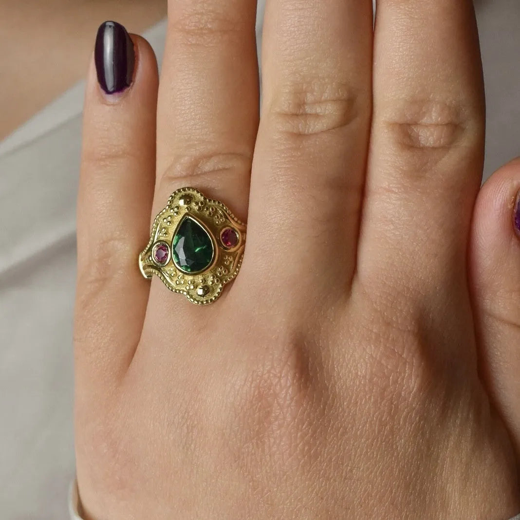 Geometric gold-plated alloy ring for women on a plain background, showing its ins style design.